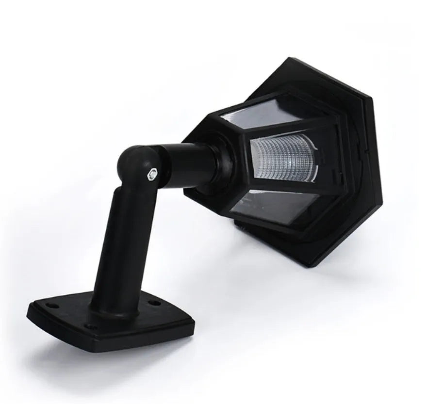 Black hexagonal solar wall light with IP44 waterproof rating for outdoor garden and pathway illumination