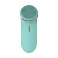 Silicone electric face cleaner in green, compact size 132x50x38mm, with USB charging cable