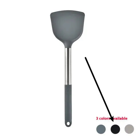 Silicone kitchen utensil set with twelve tools in a rotating white storage caddy on a counter.