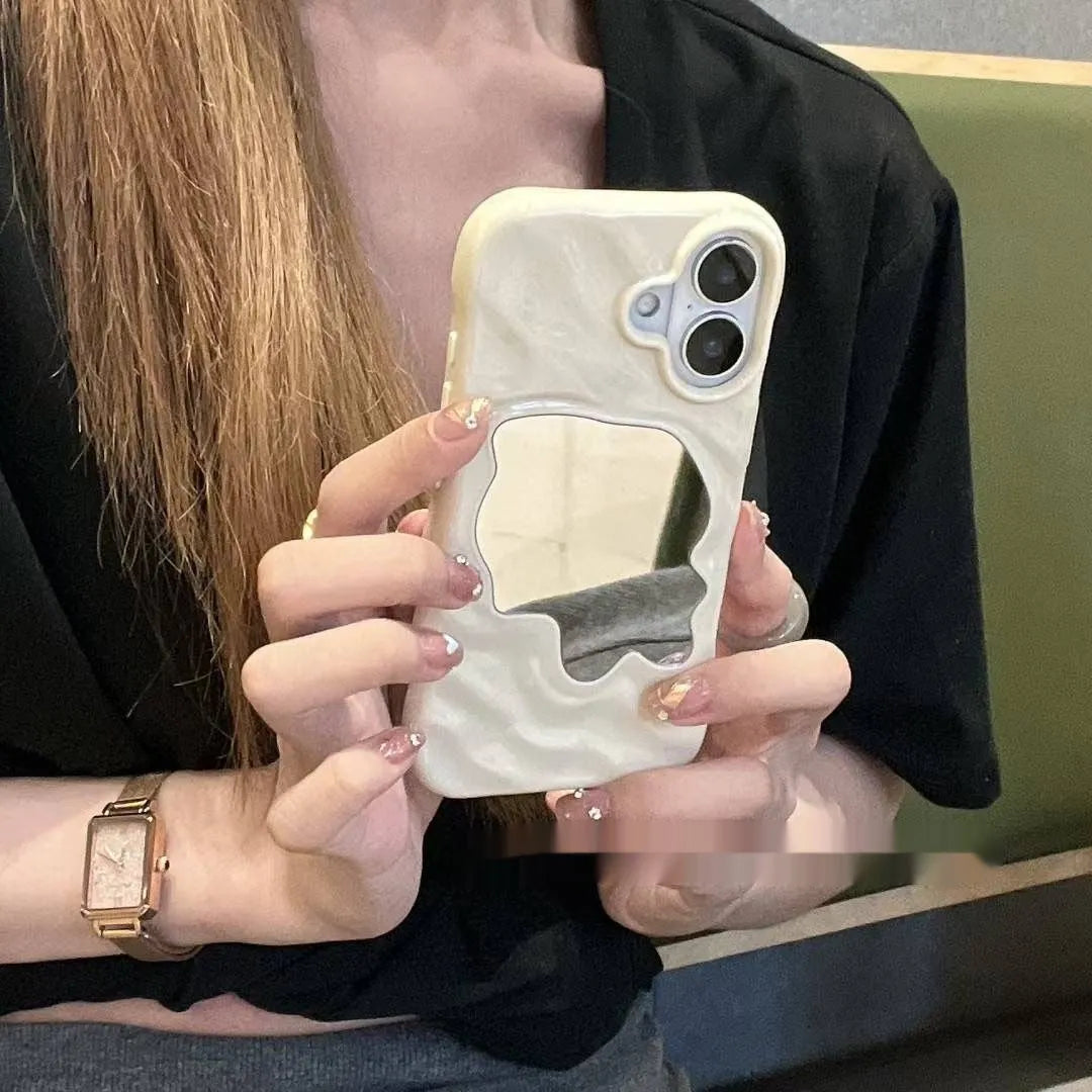 Water ripple texture solid colour mirror phone case for iPhone on a table.