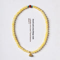 Handmade double ring bracelet for women with yellow jade and topaz stones in a retro design.