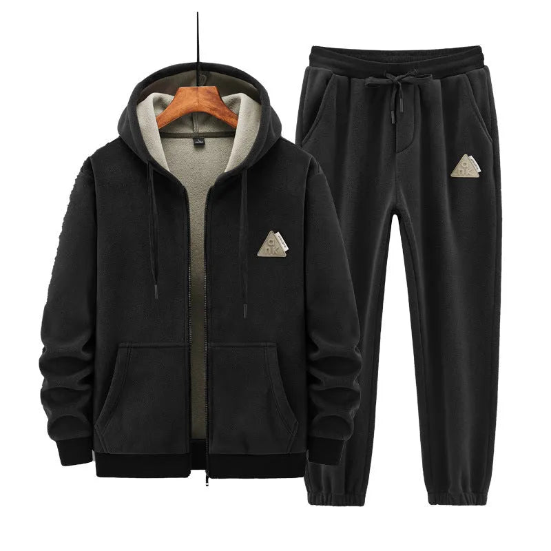 Grey men's hooded sports suit with long sleeves and full-length trousers on a neutral background.