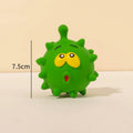 Four colourful natural latex dog balls with cute faces and textured surfaces