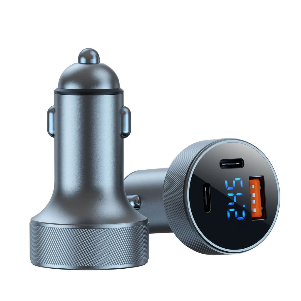 Black aluminium alloy car charger with digital display and three USB ports plugged into a vehicle socket.