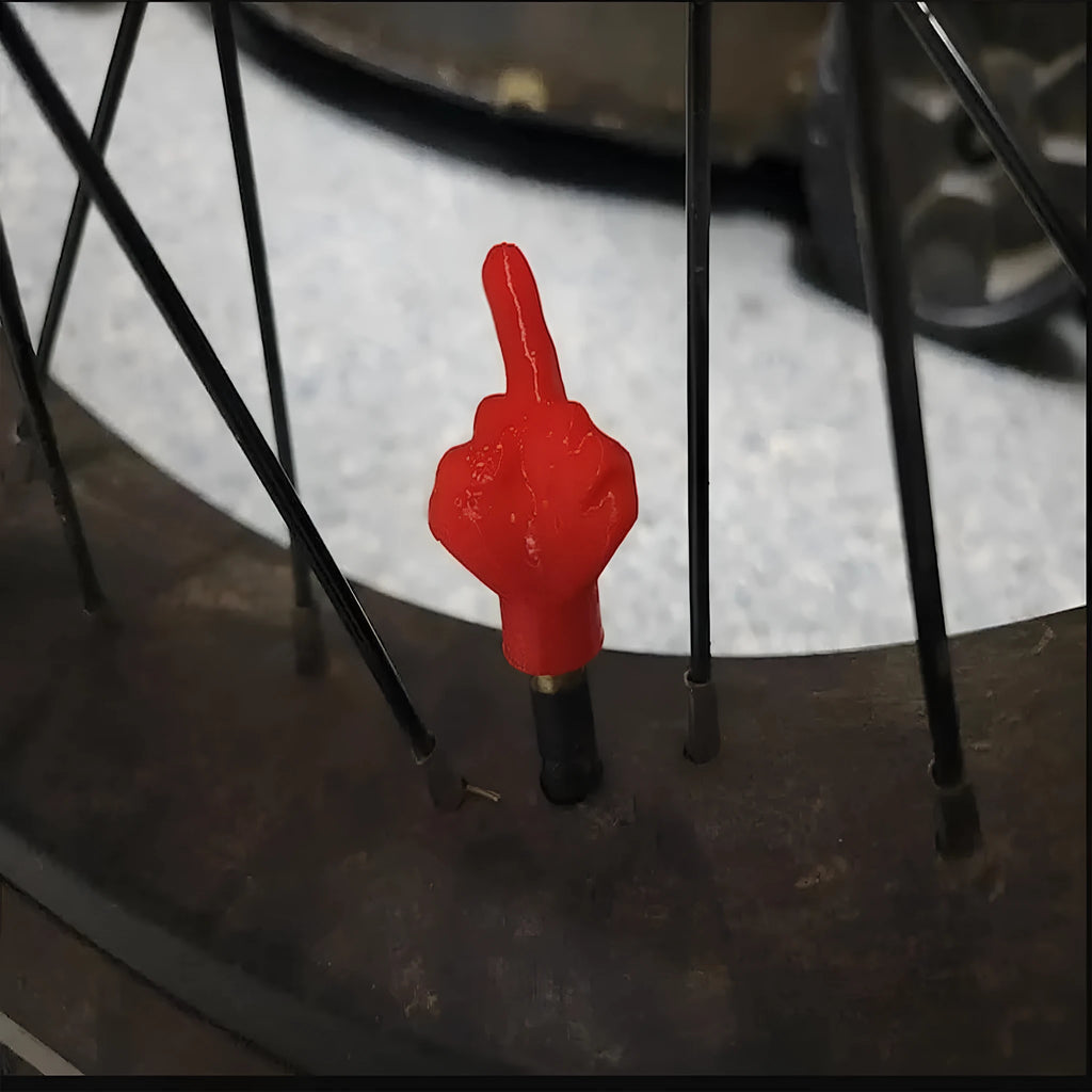 Four latex tyre valve caps shown in black and skin colours for car and motorcycle dust protection