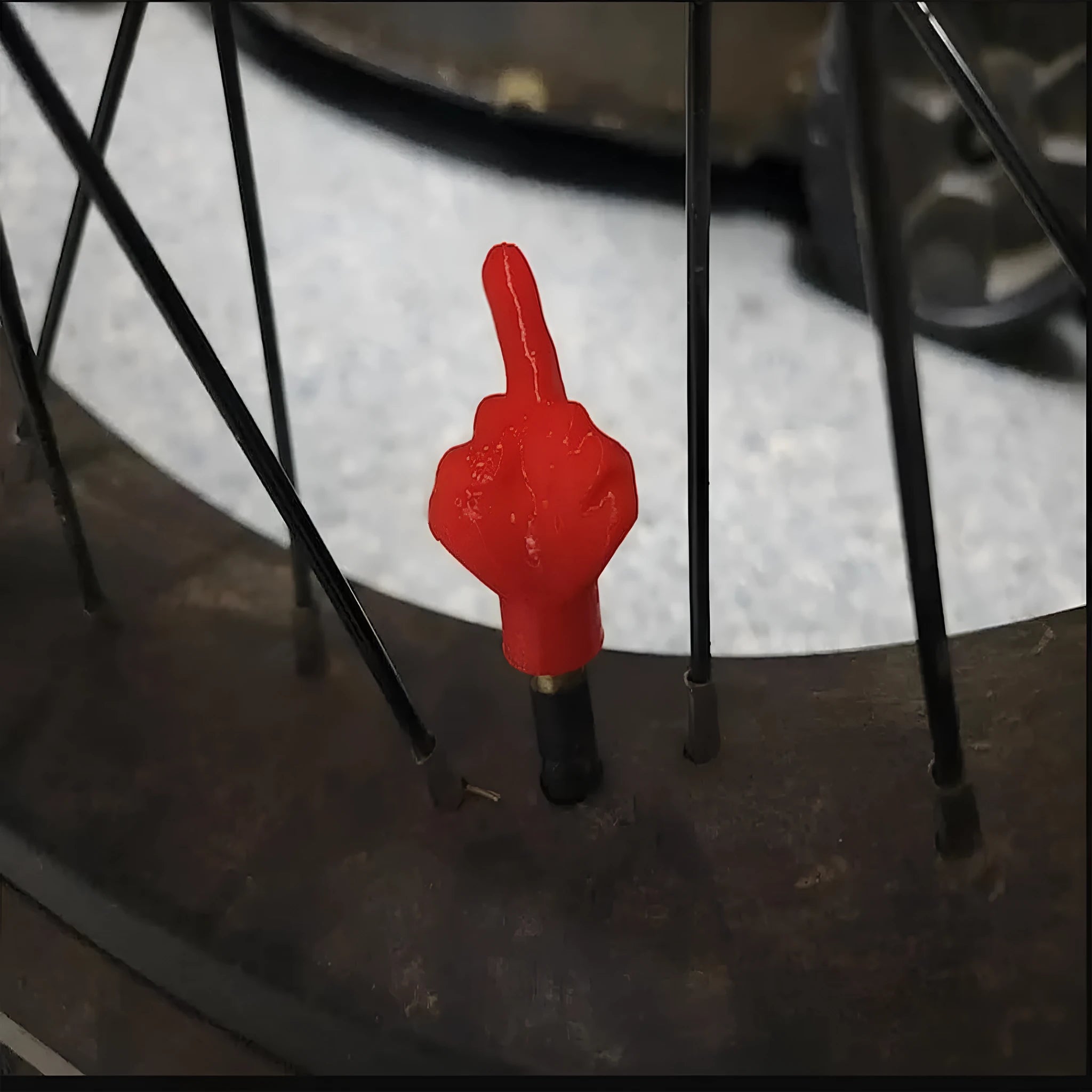 Four latex tyre valve caps shown in black and skin colours for car and motorcycle dust protection