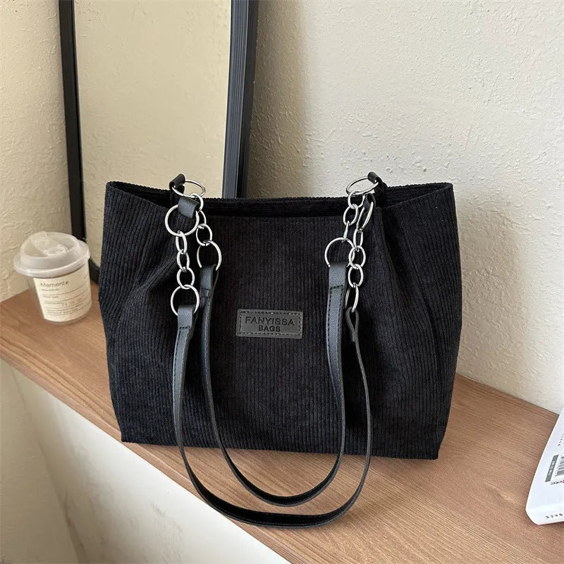 Corduroy women's tote handbag with one-shoulder strap and three-dimensional pocket in horizontal square shape