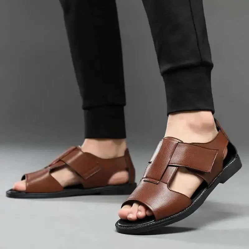 Men's black and brown cowhide leather Roman sandals with open toe and rubber sole.
