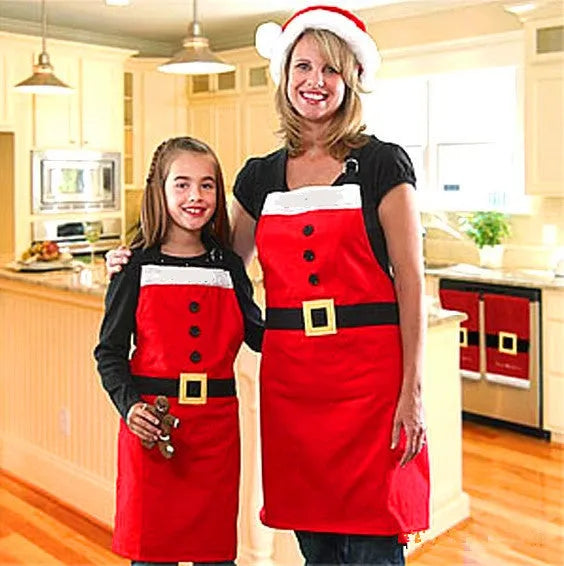 Red polyester Christmas apron shown in adult and children's sizes on a kitchen background