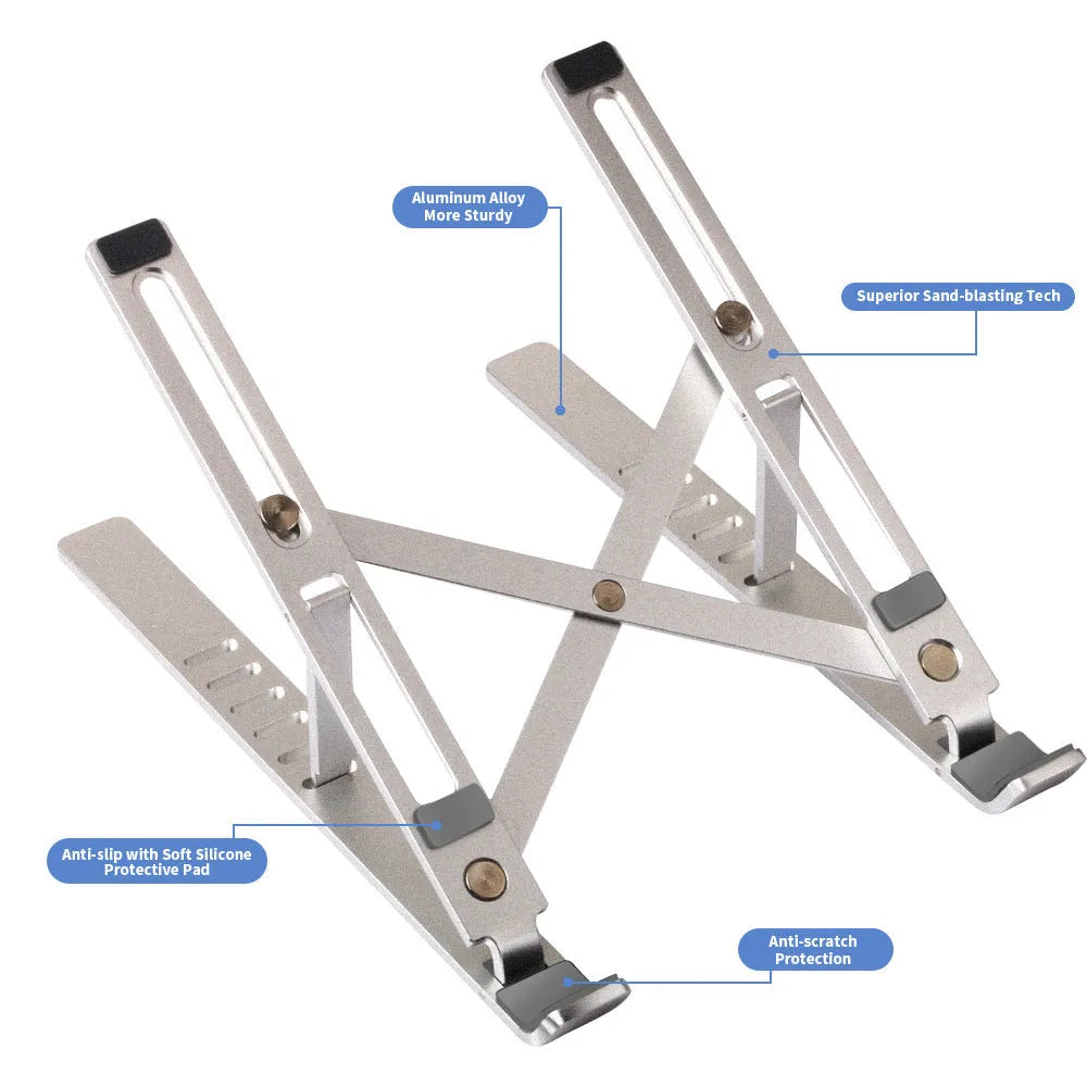 Silver aluminum folding laptop stand shown at an angle on a desk