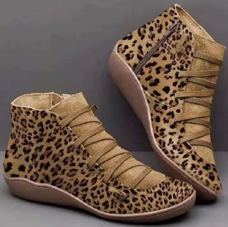 Women's casual flat booties in various colours with a round toe and wedge heel.
