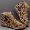 Women's casual flat booties in various colours with a round toe and wedge heel.