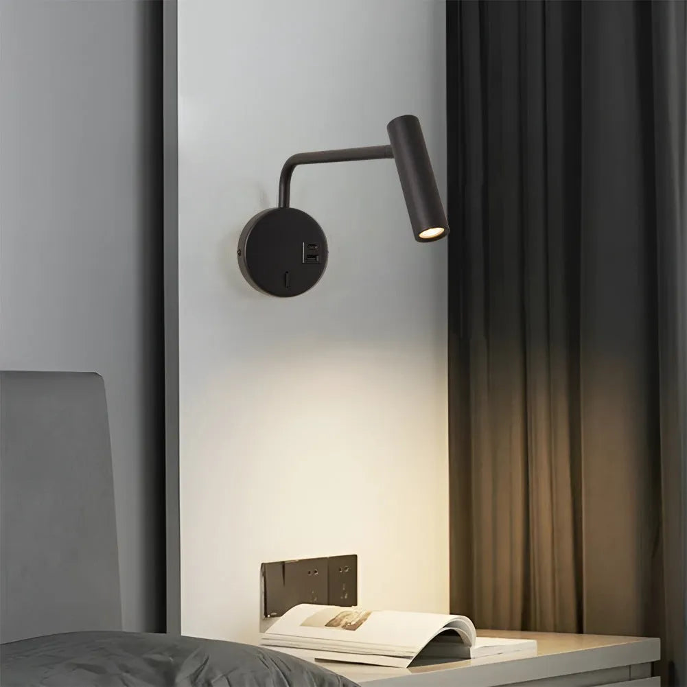 Rocker LED reading wall lamp in black finish with adjustable arm and head for bedside use