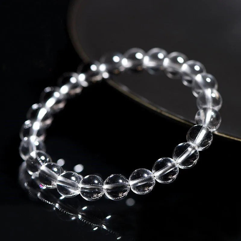 Natural Donghai old materials white water round bead crystal bracelet in old mine white on a wrist.