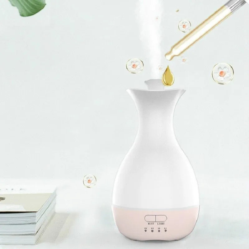 White ultrasonic humidifier with colourful night light functioning as aromatherapy diffuser and flower vase