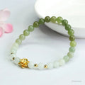 Ancient style jade bracelet with clear water gradient colour and lotus flower design