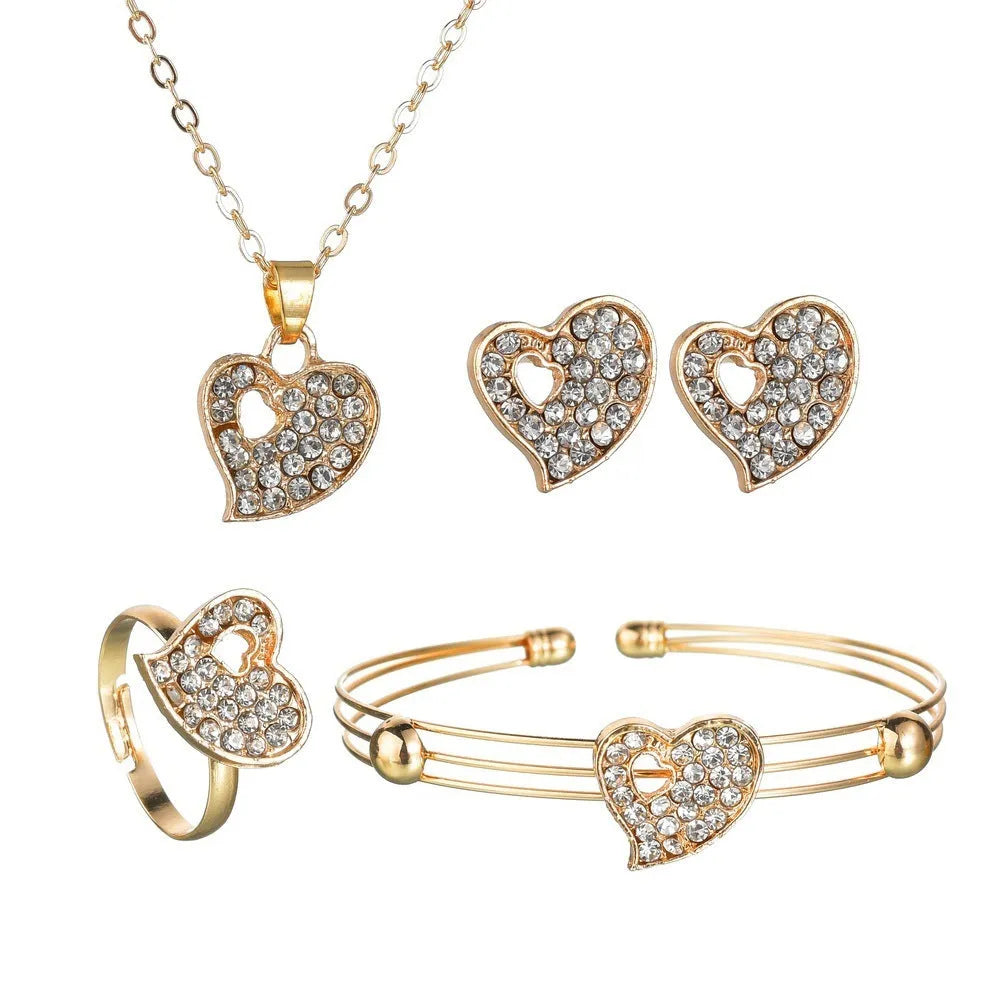 Women's gold tone alloy jewelry set with matching earrings, pendant and bracelet featuring love patterns
