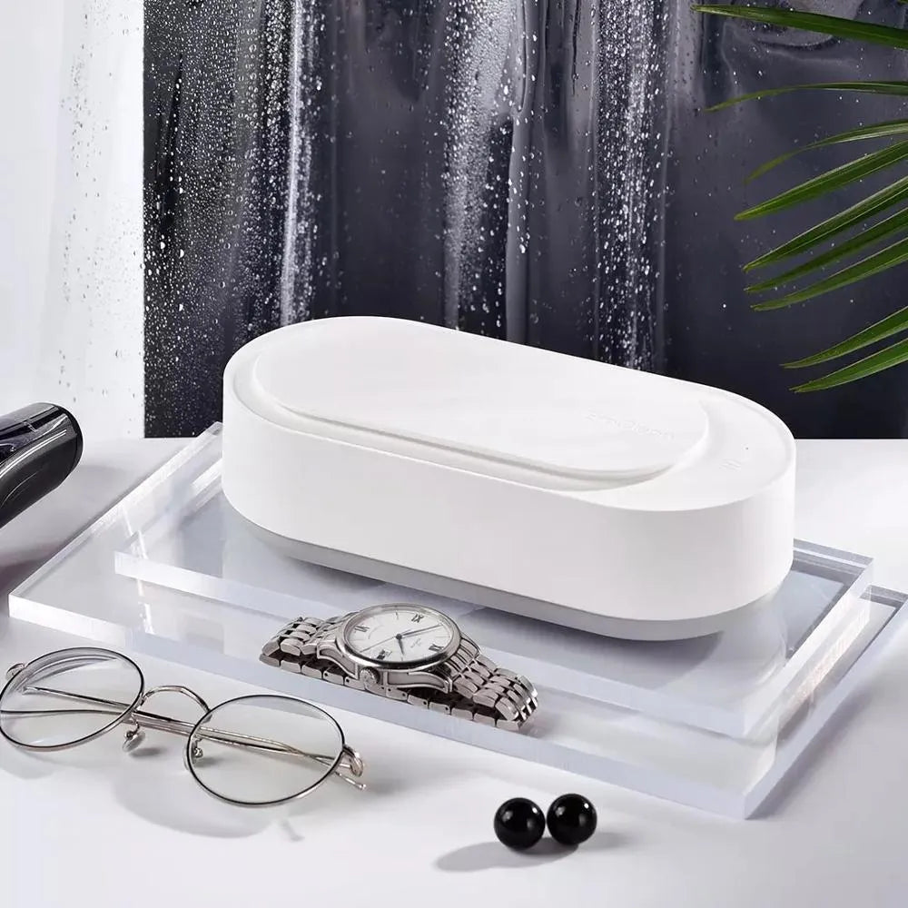 White portable ultrasonic cleaning machine with stainless steel tank and digital timer display.