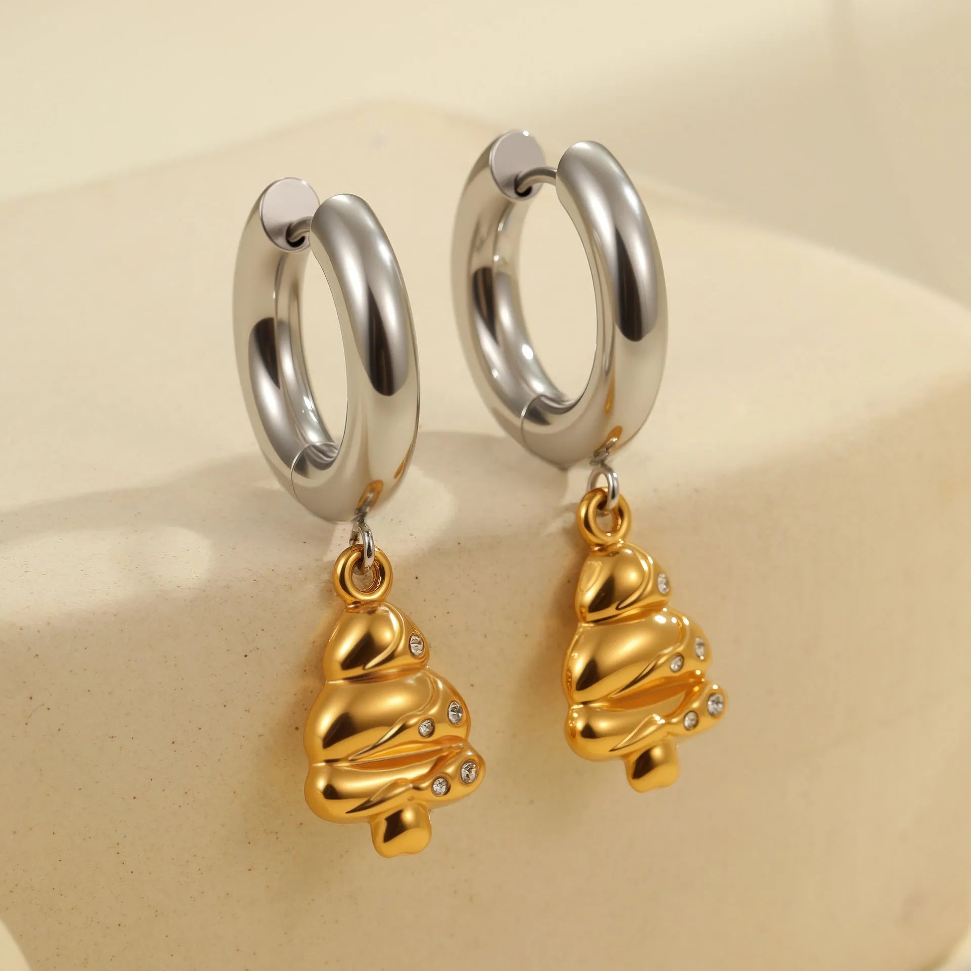 Women's stainless steel Christmas tree and heart earrings with electroplated finish showing geometric shapes