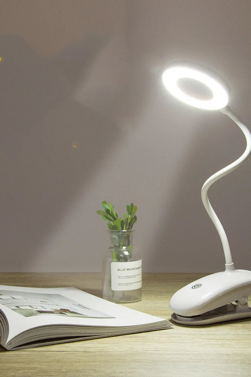 Clip-on rechargeable desk lamp with touch controls showing modern minimalist design