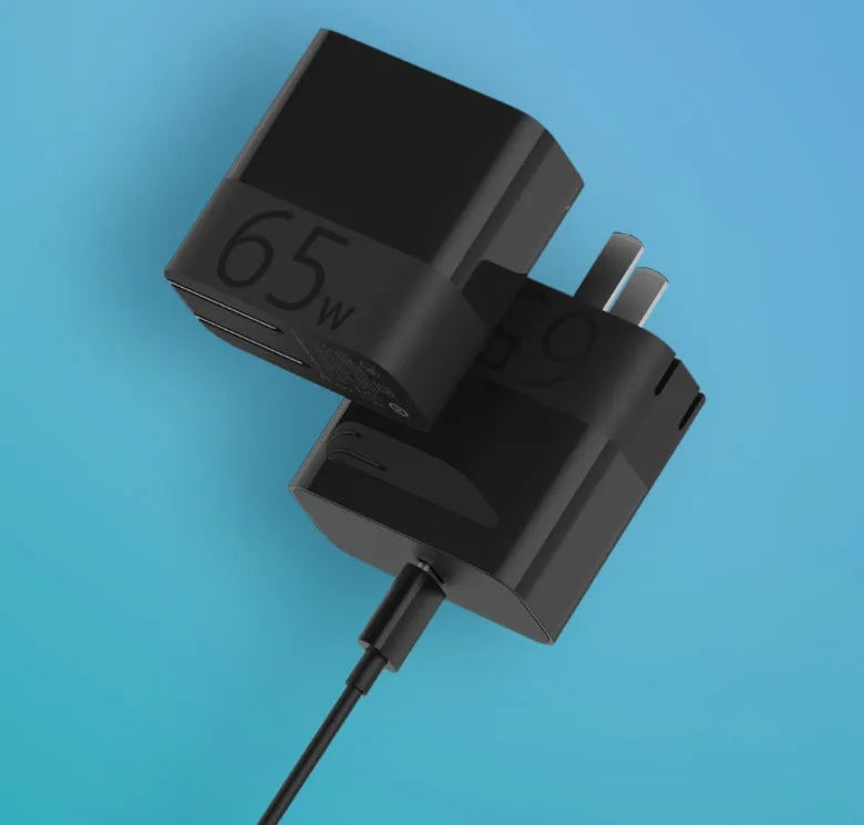Black 65W USB-C laptop power adapter showing compact design with single USB-C output port