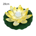 LED lotus lamp 18 cm EVA foam decorative light in white on a wooden table