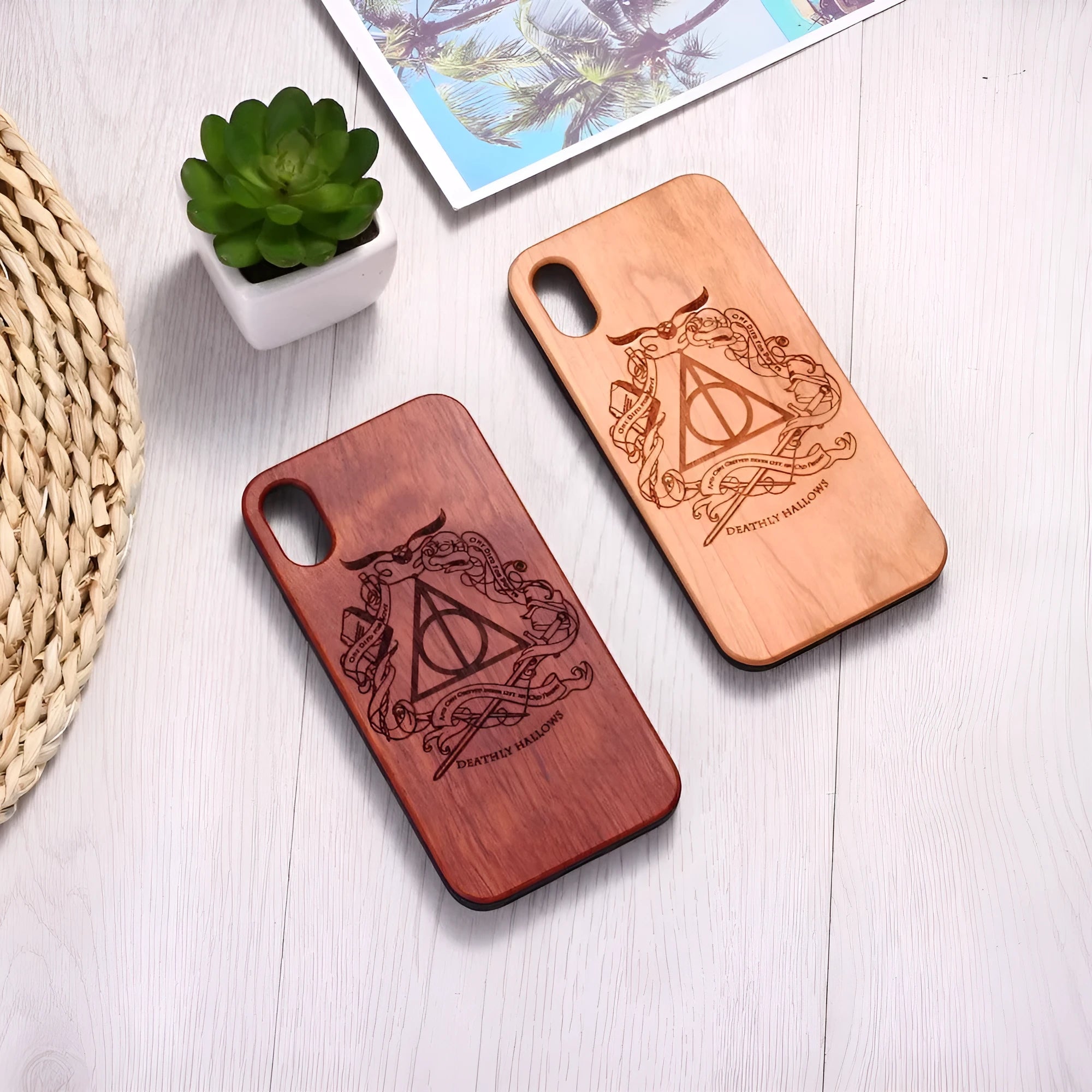 Wooden phone case with laser-carved design on a wooden back and a black TPU frame.