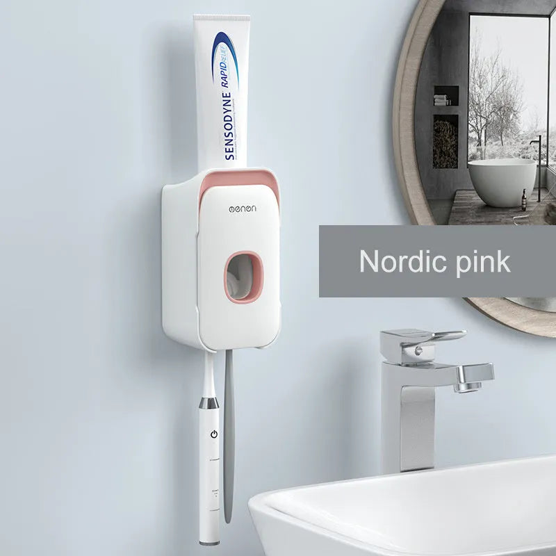 Blue automatic wall-mounted toothpaste dispenser with a sensor for touchless operation on a bathroom wall.