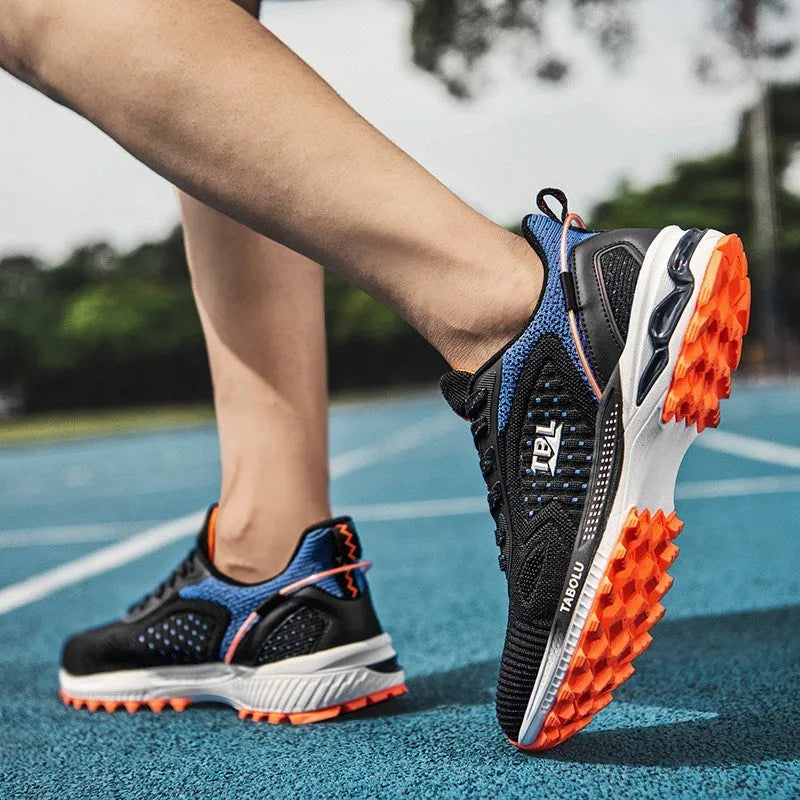 Junior high school running shoes with non-slip rubber sole and mesh upper, side view, in Black Grey colour