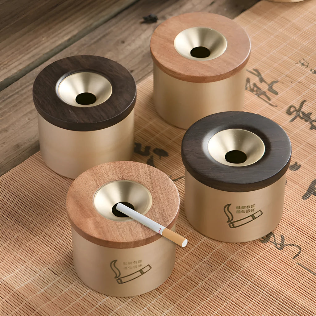 Brass ashtray with wooden lid in retro style showing middle hole design