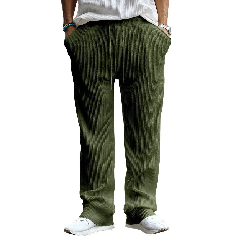 Men's loose straight leg trousers in polyester fabric showing high waist design and casual fit