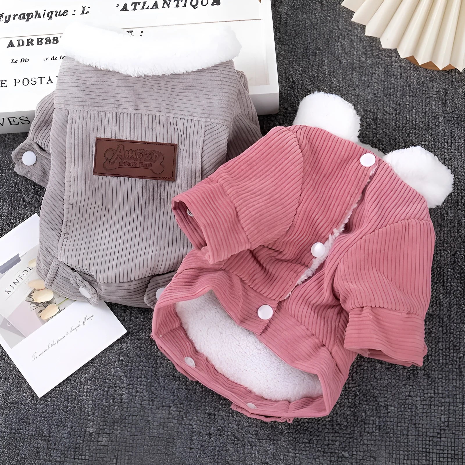 Grey fleece-lined lambswool vest for a dog, showing wool lining and padded design.