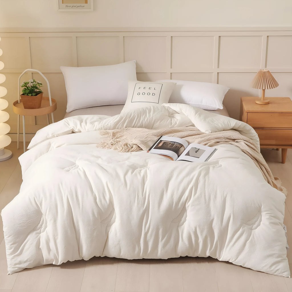 Soybean fibre quilt with pure cotton twill cover in grey, shown on a bed.