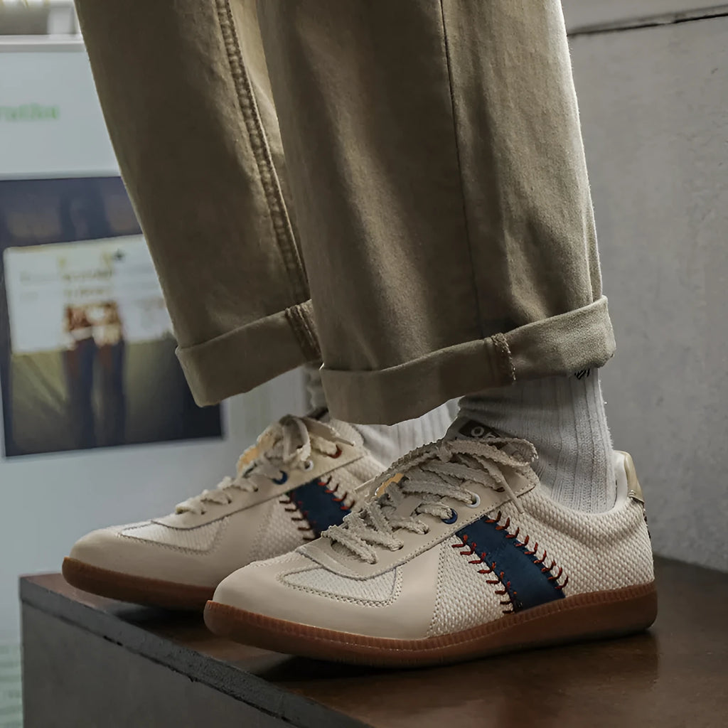 White mesh men's fashion casual exercise sneakers with flat heel on display