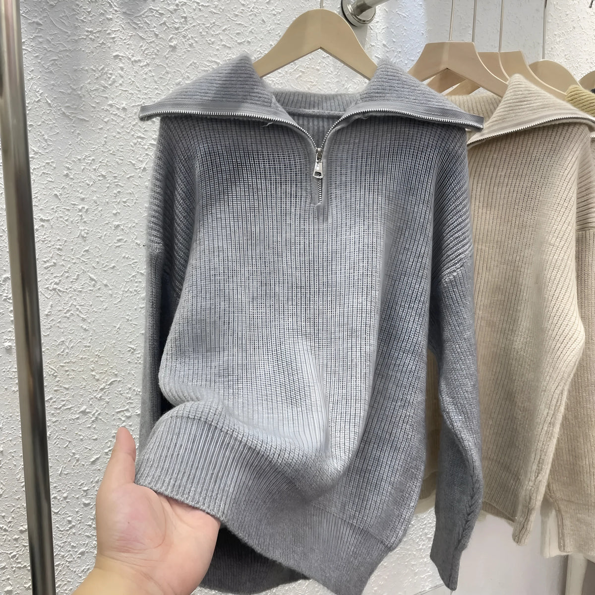 Women's loose fit pullover sweater with polo collar in soft viscose knit, solid colour, available in seven shades