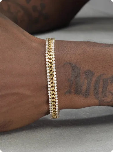 Gold-coloured hip hop style tennis bracelet for men and women on a wrist.