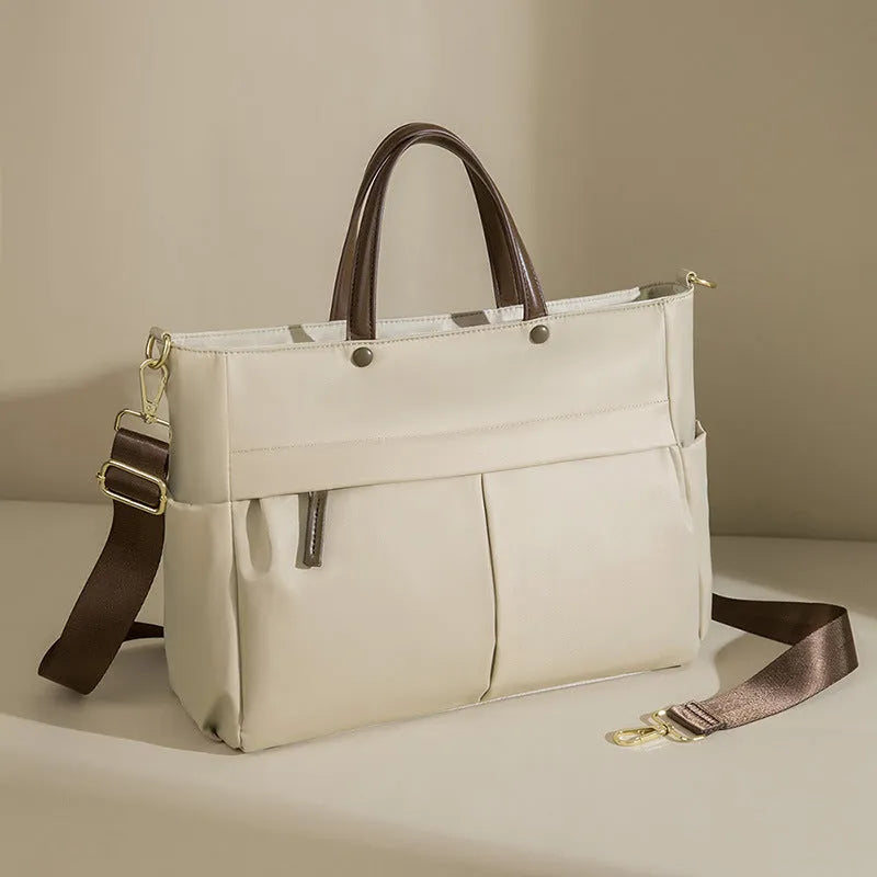 Women's oxford cloth portable briefcase in nuts and apricots colour with contrast stitching.