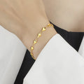 Titanium steel gold chain heart bracelet electroplated colour for women on white background