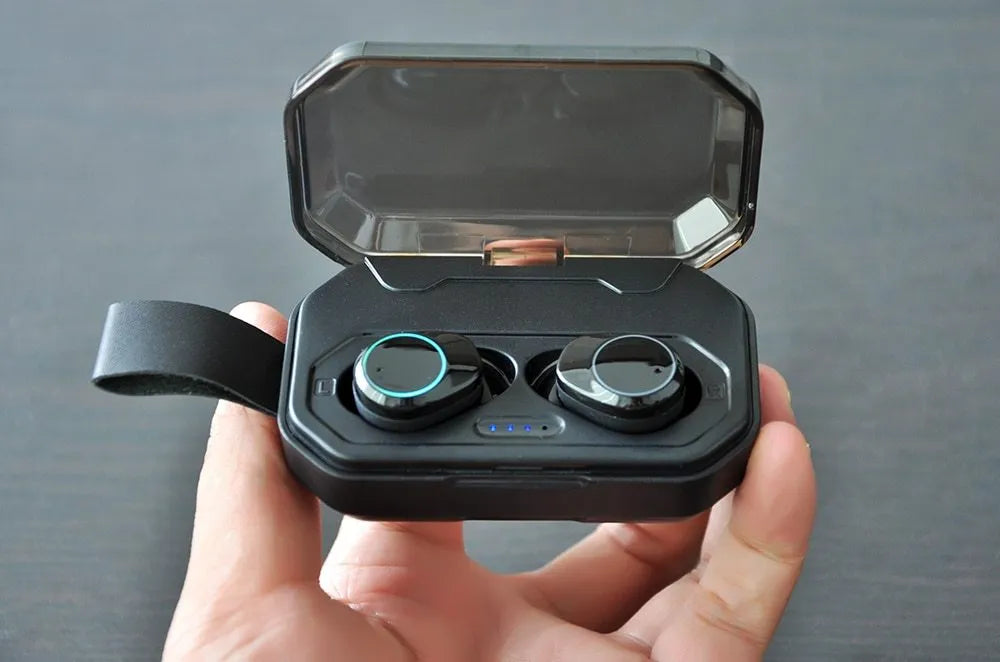 Black wireless Bluetooth 5.0 in-ear earbuds with ear hooks and charging case for iPhone and Android.