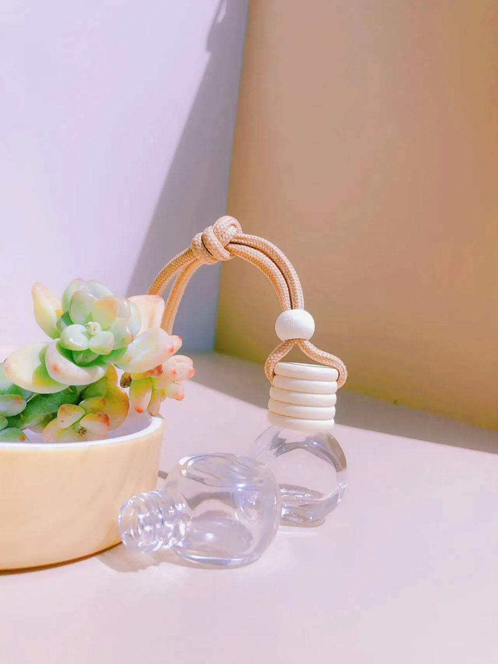 Glass car perfume pendant fragrance diffuser in cylinder, diamond, flat drum, and square styles.