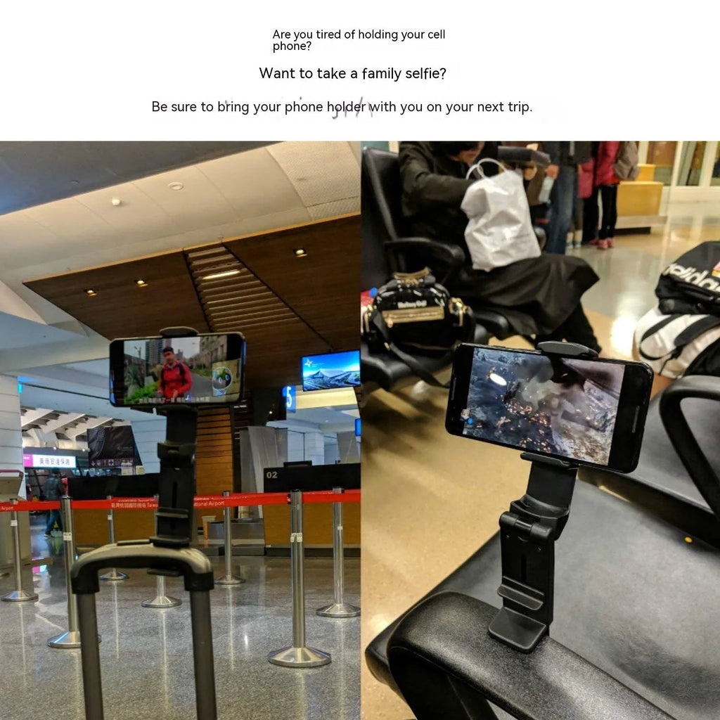 Black foldable rotating universal phone holder made of ABS plastic on a table.