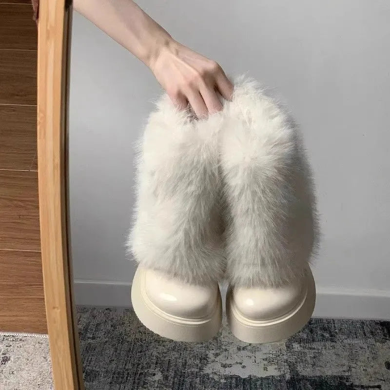 Women's black low-top snow boots with plush fleece lining and a waterproof rubber platform sole