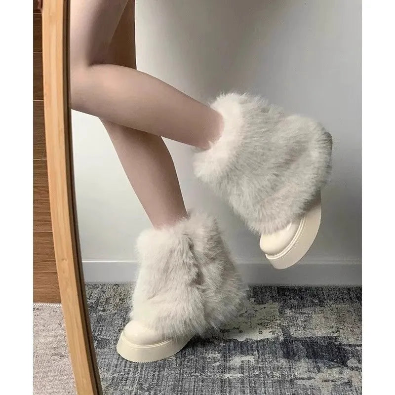 Women's black low-top snow boots with plush fleece lining and a waterproof rubber platform sole