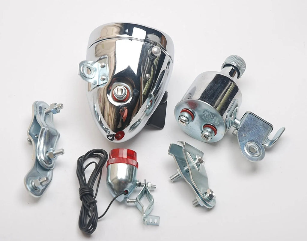Silver bicycle dynamo-powered generator light kit for mounting on frame, showing wiring connectors.