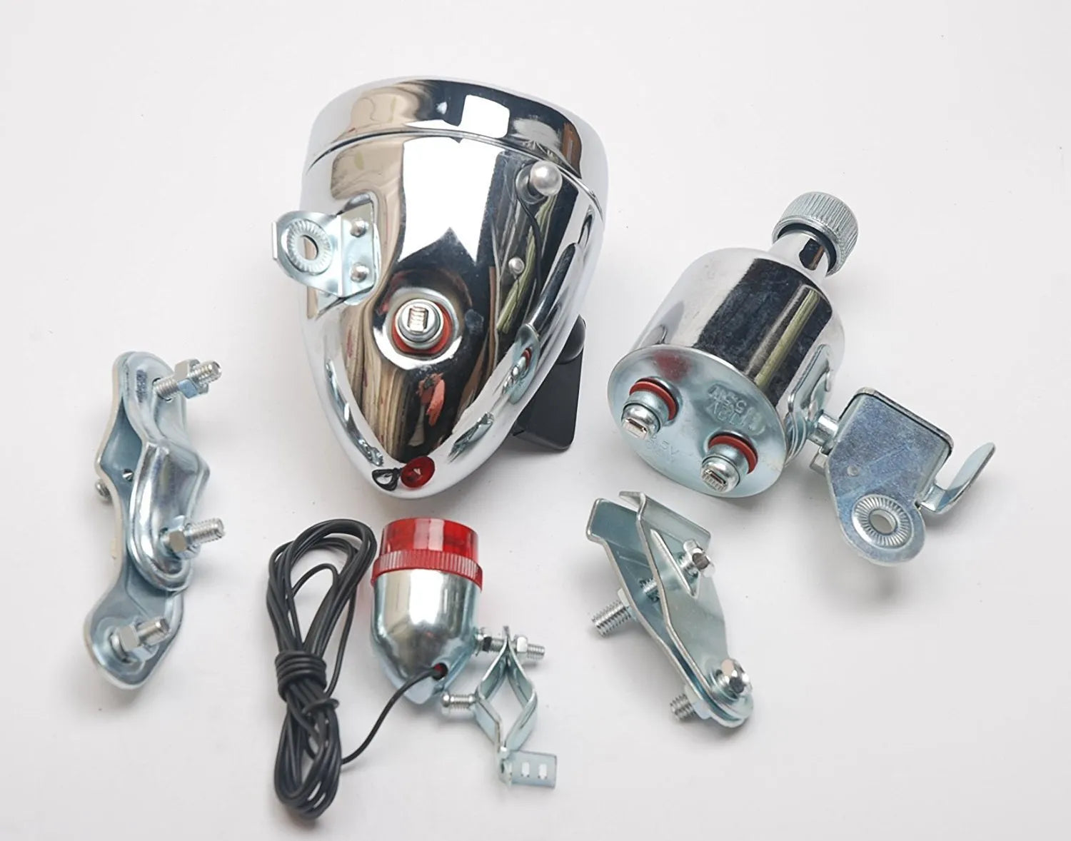 Silver bicycle dynamo-powered generator light kit for mounting on frame, showing wiring connectors.