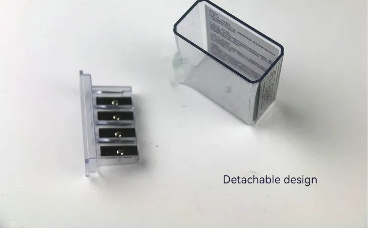 Geometric plastic pencil sharpener with four holes, shown with blades and a screwdriver.