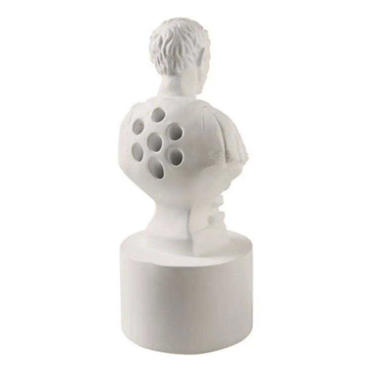 White synthetic resin American creative character pen holder on a desk