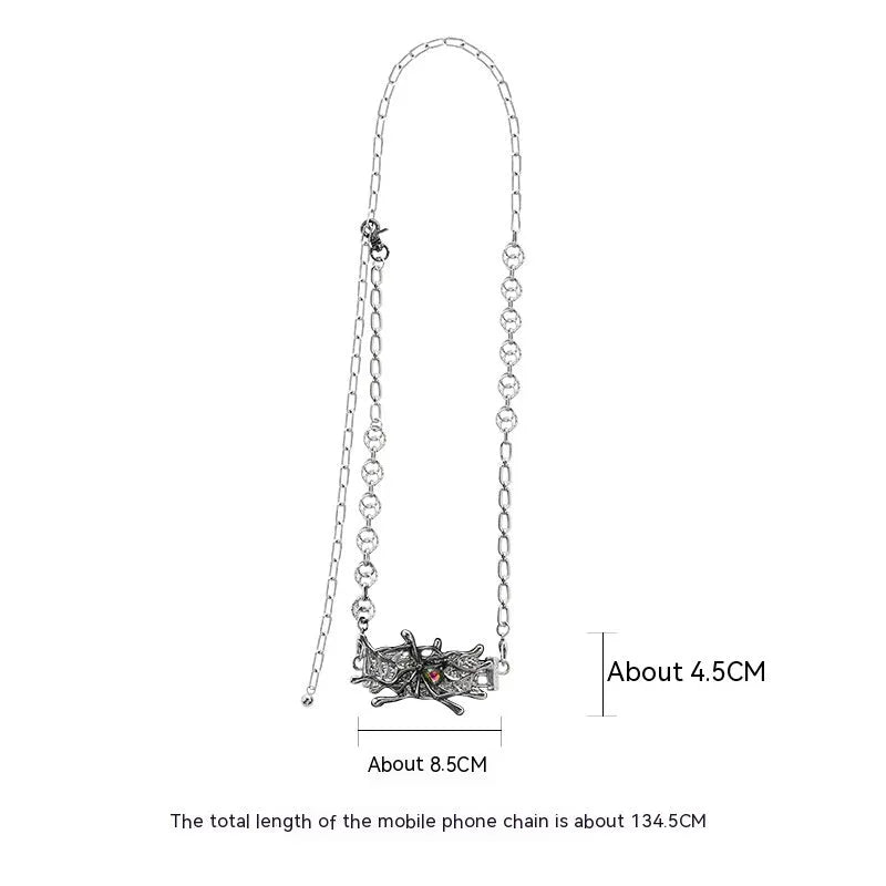 Spider moonstone alloy phone charm with electroplated silver finish and insect pattern pendant on chain.