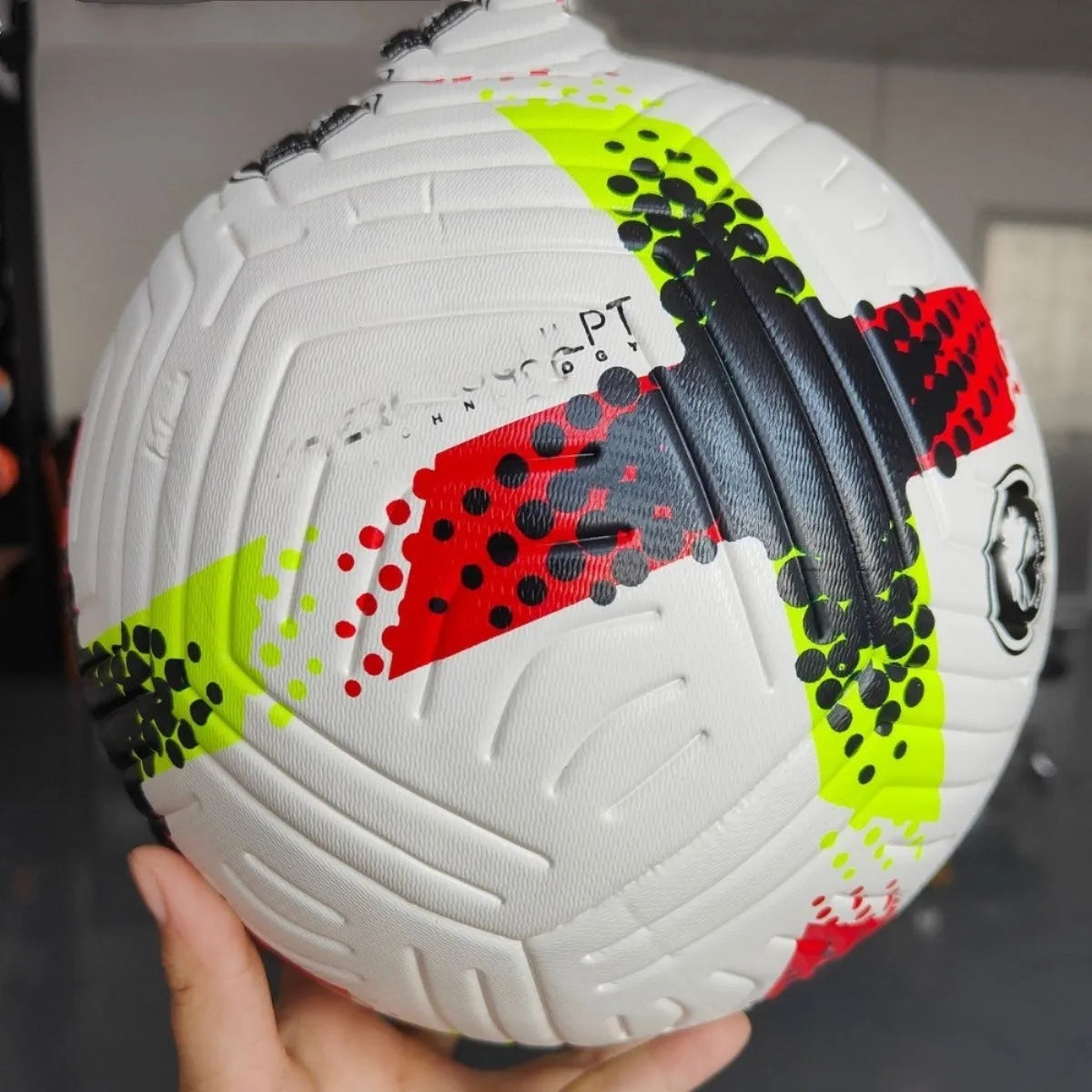 Fluorescent green Size 5 football with seamless construction for training and multi-sport use