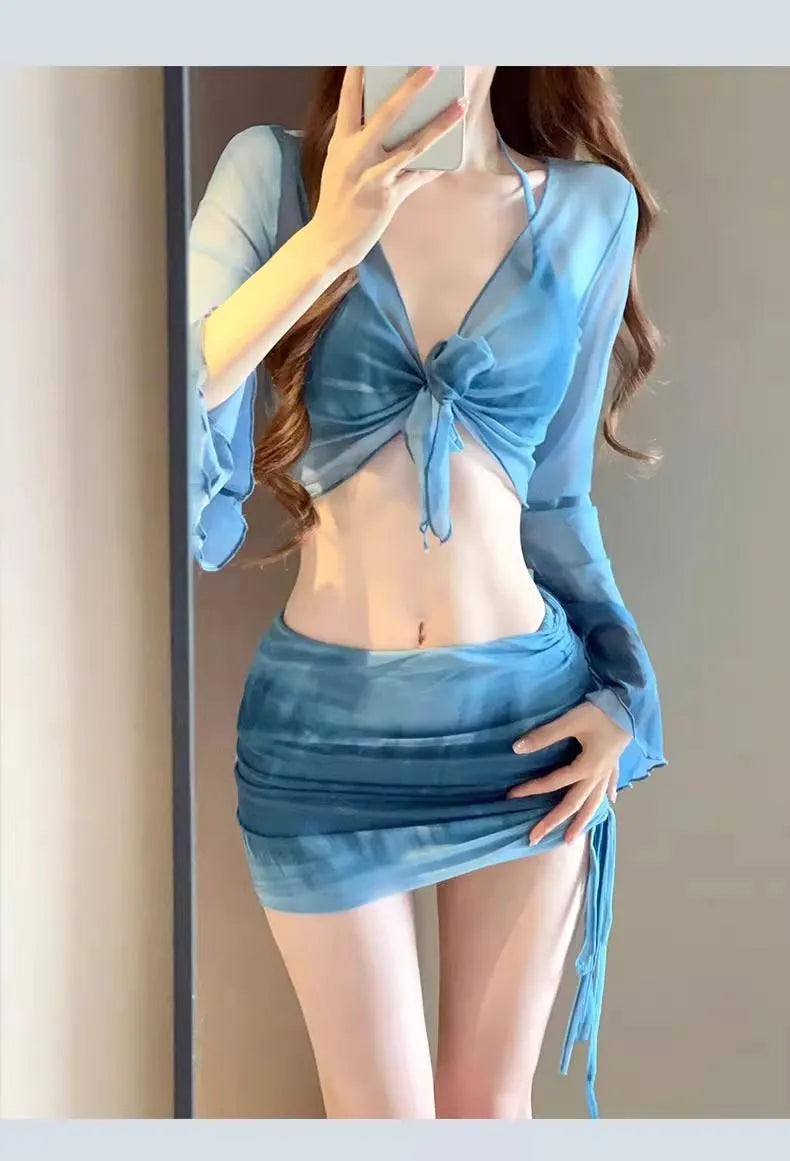 Women's blue high-waisted bikini four-piece set with shirt and skirt on a mannequin